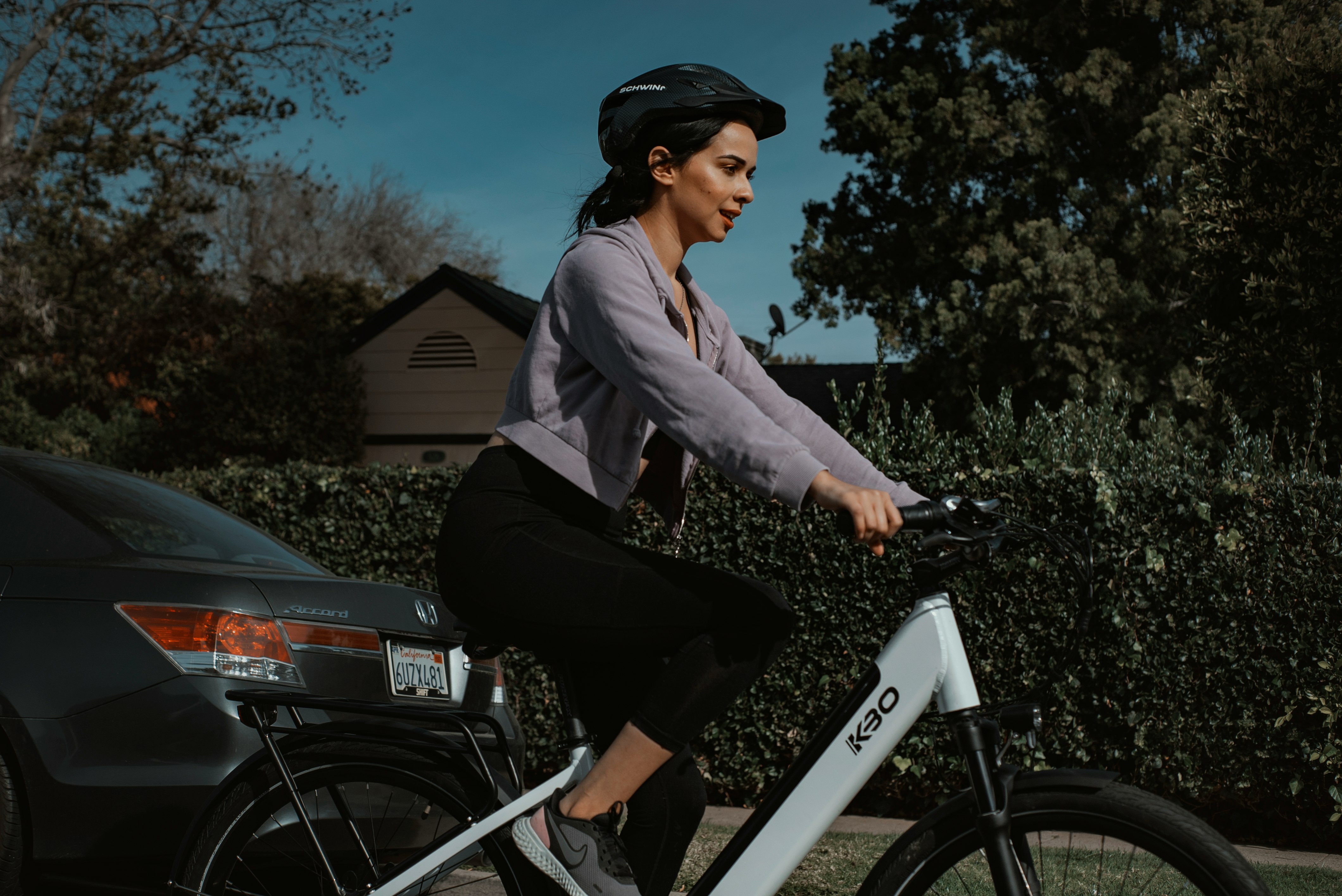 man in gray dress shirt riding motorcycle